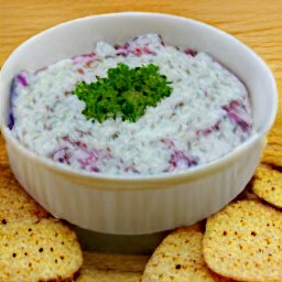 the dish is covered with cling film and set aside for 120 minutes. then the cling film is removed and the dish is served with water crackers.