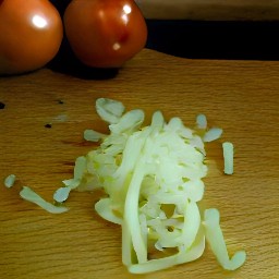 after peeling and chopping the onions, chop the tomatoes and cilantro.