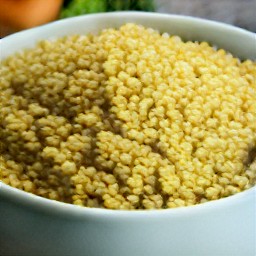 a bowl of bulgur with salt, black pepper, and boiled water.