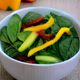 the output is a bowl of salad with baby spinach leaves, cucumber slices, semi-dried tomatoes in oil, and yellow bell pepper strips mixed together.