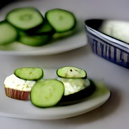 the cream cheese, cucumber slices, and italian dressing are arranged on top of the miniature party rye loaf.