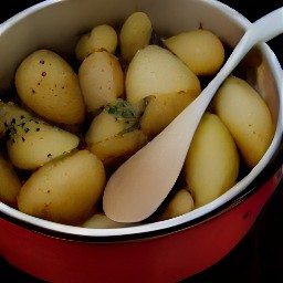 a casserole dish full of potatoes that have been mixed with olive oil, thyme leaves, crushed rosemary, salt, and black pepper.