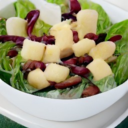 the contents of the bowl are transferred to a plate.