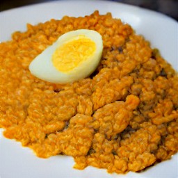 the eggs are transferred to the rice and lentils.