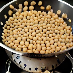 a can of chickpeas in a colander.