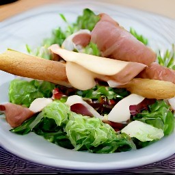 a top pear and cheese salad with wrapped grossing breadsticks.