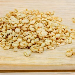 the hazelnuts are transferred to a board and grated.