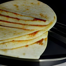 a stuffed flour tortilla with melted cheese.