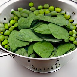 the veggie mixture is drained in a colander.