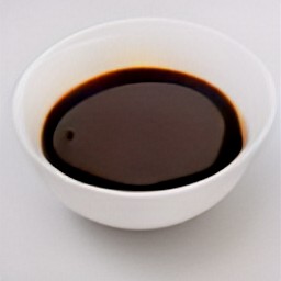 the boiled balsamic vinegar is transferred to a bowl.