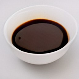 the boiled balsamic vinegar is transferred to a bowl.