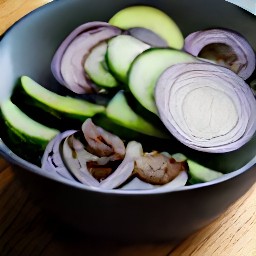a bowl containing a mushroom mixture made of portabello mushrooms, dried oregano, olive oil, zucchini, and red onions.
