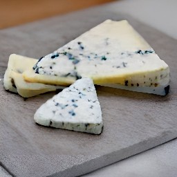 the blue cheese is cut into slices.