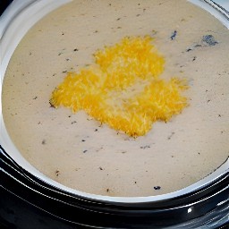 the onion mixture is in a crockpot with a lid on it, cooking on high heat for 4 hours.