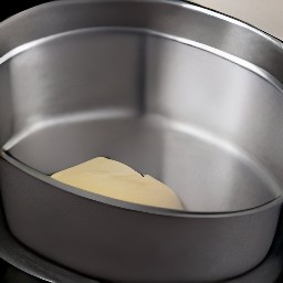 a cake pan greased with an eighth cup of butter and the batter transferred to the cake pan.