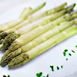 a plate of asparagus with parmesan butter.