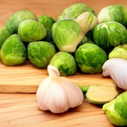 peeled and chopped garlic, and cut brussels sprouts in half.