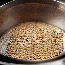 the toasted sesame seeds evenly distributed over the greased cake pan.