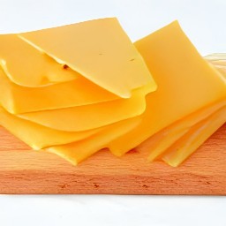 a slice of cheddar cheese.