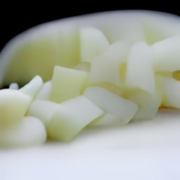 a bowl of chopped onions and green onions.
