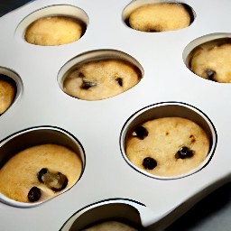 there 12 muffins with batter in them.