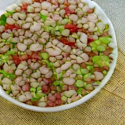 a chilled mixture of pinto beans, white corn, cowpeas, red bell peppers, green bell peppers, onions and vinaigrette.