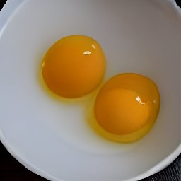 the eggs are cracked into a medium bowl.