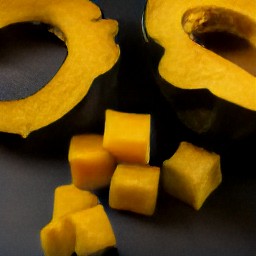 after deseeding the acorn squash and peeling and cutting the carrots, you will have 1-inch cubes of each vegetable.