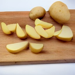 potatoes cut into wedges, then onions peeled and chopped.