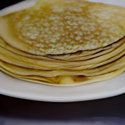 the food is transferred from the cooking surface to a plate.