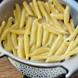 the penne is drained in a colander.