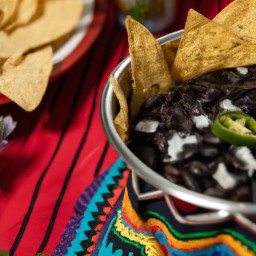 

This vegan, lactose-free, gluten-free, eggs-free and nuts/soy free Mexican side dish of spiced black beans served with tortilla chips is a delicious and healthy way to enjoy a classic dish.