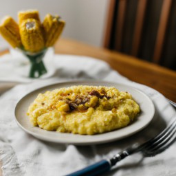 
Cheesy corn and grits is a delicious gluten-free, nut-free American side dish made with cheddar cheese, eggs, whole milk and creamed corn.