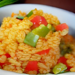 the mexican rice was transferred to a serving plate.
