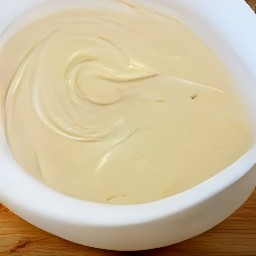 a bowl of melted white almond bark.