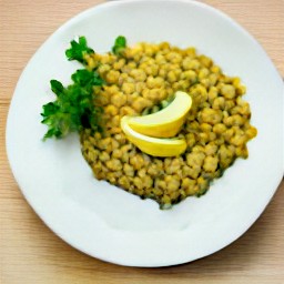 the cooked lentils are transferred to a serving plate, then topped with chopped cilantro and lemon wedges.