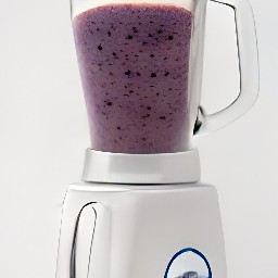 a smoothie with orange cubes, blueberries, and whole milk.