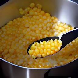 the corn is transferred to a saucepan.