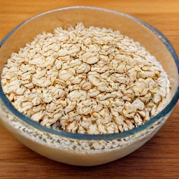 a bowl of rolled oats mixed with buttermilk, which has been set aside for 60 minutes to get a rolled oats mixture.