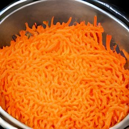 the carrots that were scraped drained in a sieve.
