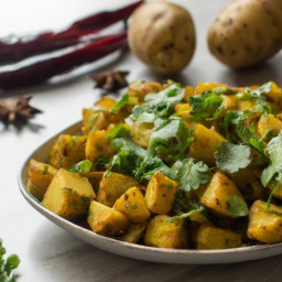 

This Indian vegan side dish of spicy potatoes is a delicious, gluten-free and allergen-friendly mix of potatoes and tomatoes.