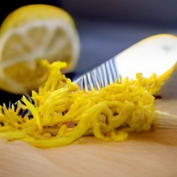 the zester will remove the lemon's outermost layer, which is full of flavor.