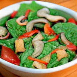 the salad is transferred to a serving plate.