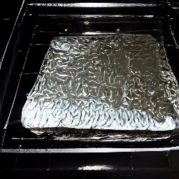 a baking sheet with cookies on it placed in a hot oven and baked for 25 minutes.