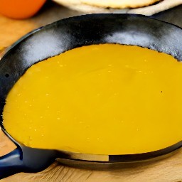 the pumpkin pancake is now flipped over and can continue cooking on the other side.