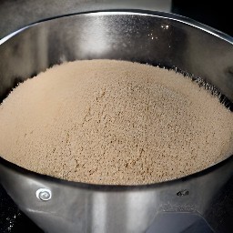 a bowl containing a mixture of oat bran, baking powder, cinnamon, and nutmeg.