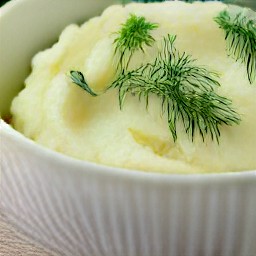 this action will serve mashed potatoes with onion and dill in a serving bowl.