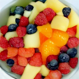 the fruit salad mixture is divided into serving bowls.