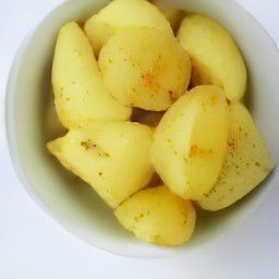 the potatoes are fully coated with the mixed dressing.
