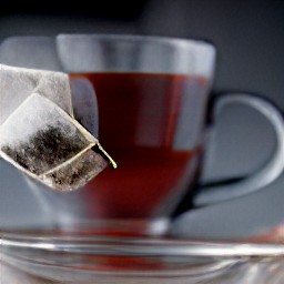 the tea bag is in the hot juice mug.